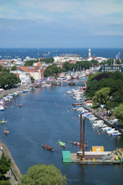 blue river surrounded by houses