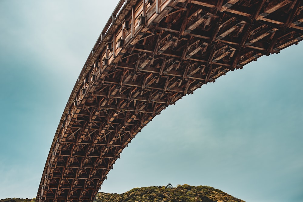 brown bridge under blue sky