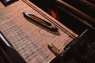 black metal part on brown textile