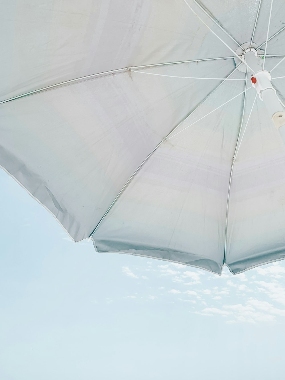 low-angle photography of white parasol