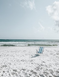 black armchair on seashore