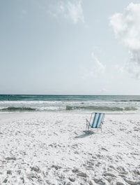 black armchair on seashore