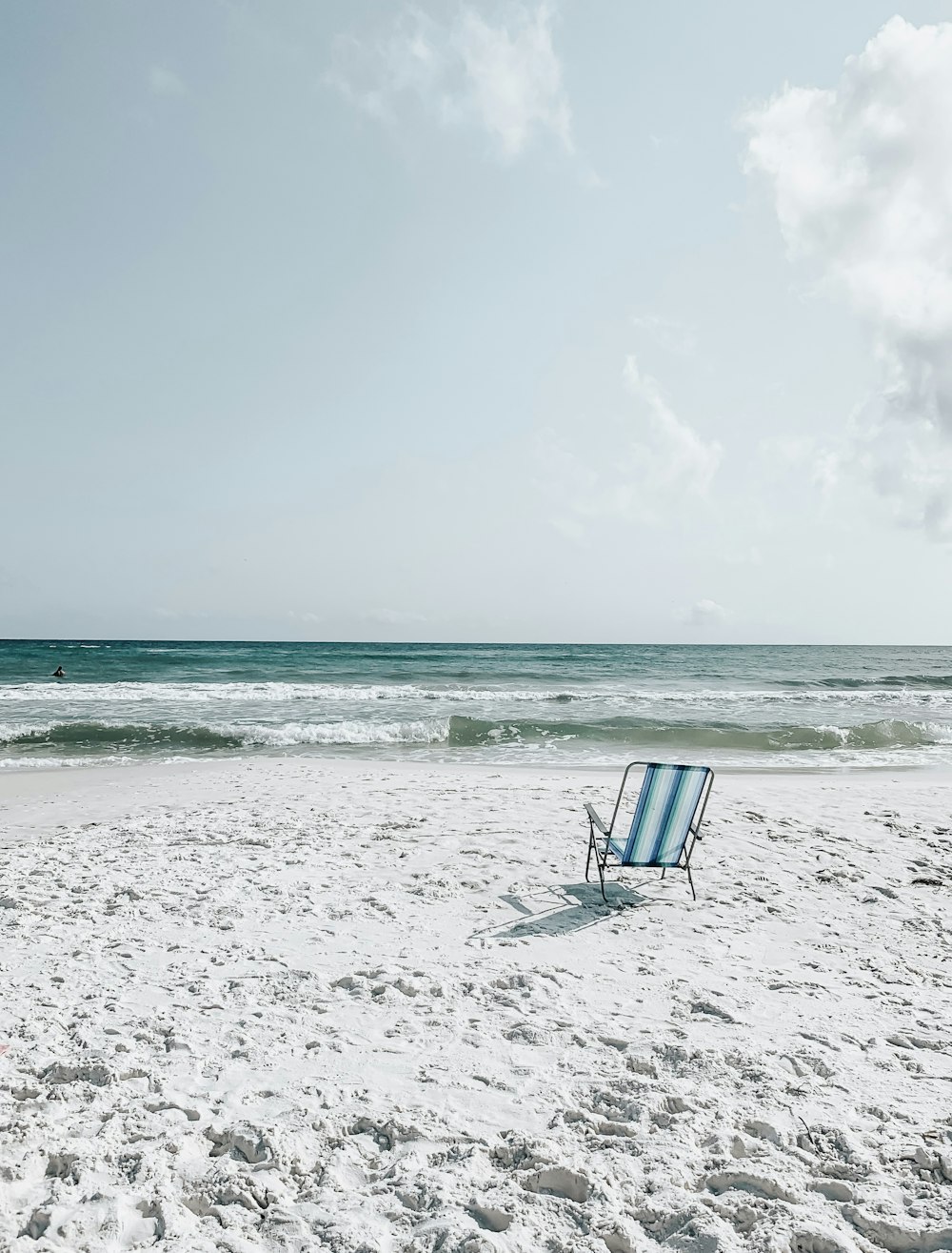 black armchair on seashore