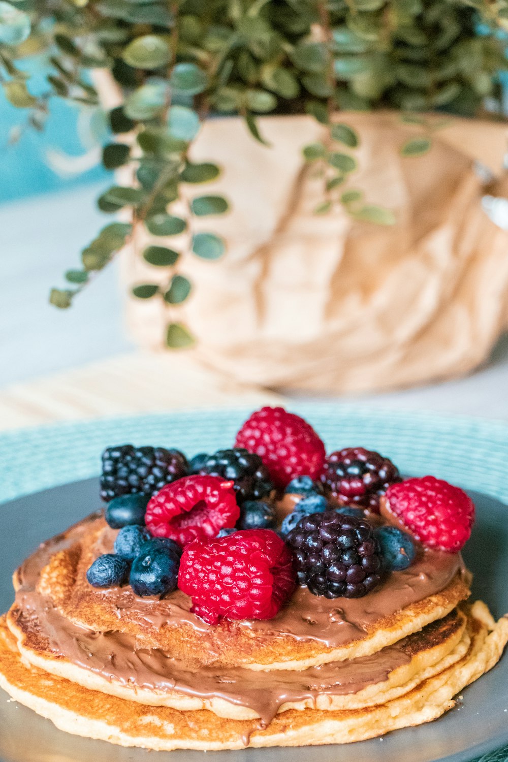 blackberries, raspberries, and blueberries on pancake