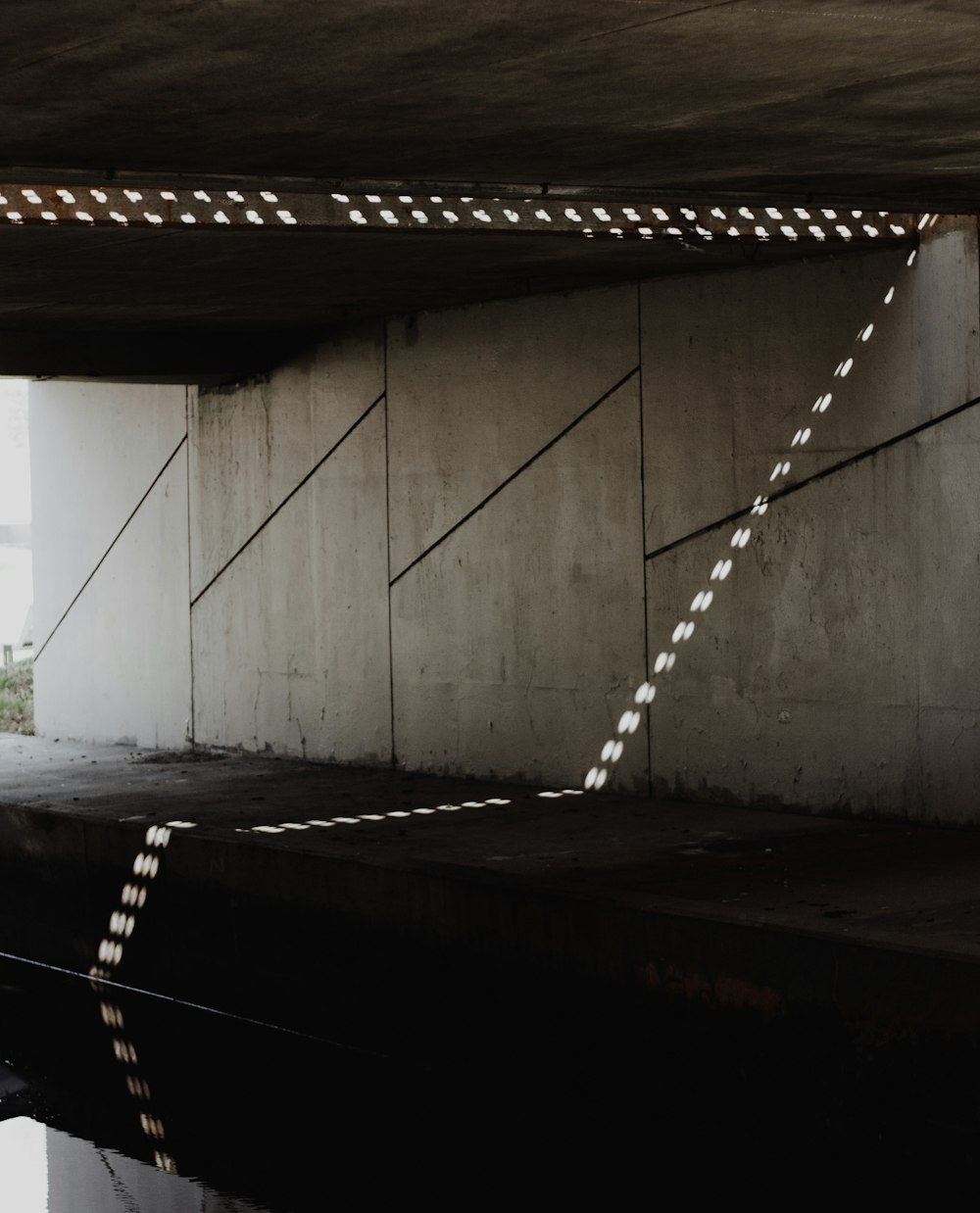 a black and white photo of a bridge