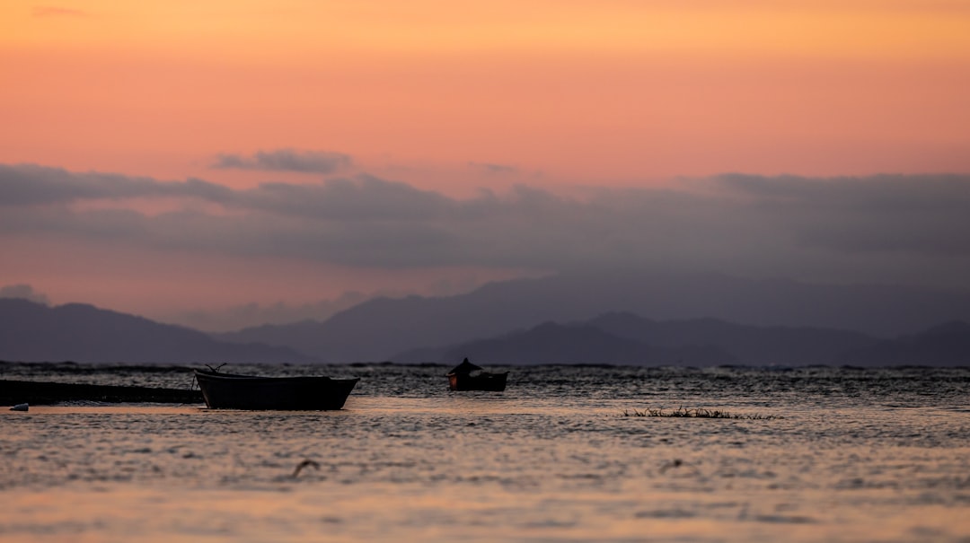 silhouette photography of person in boat