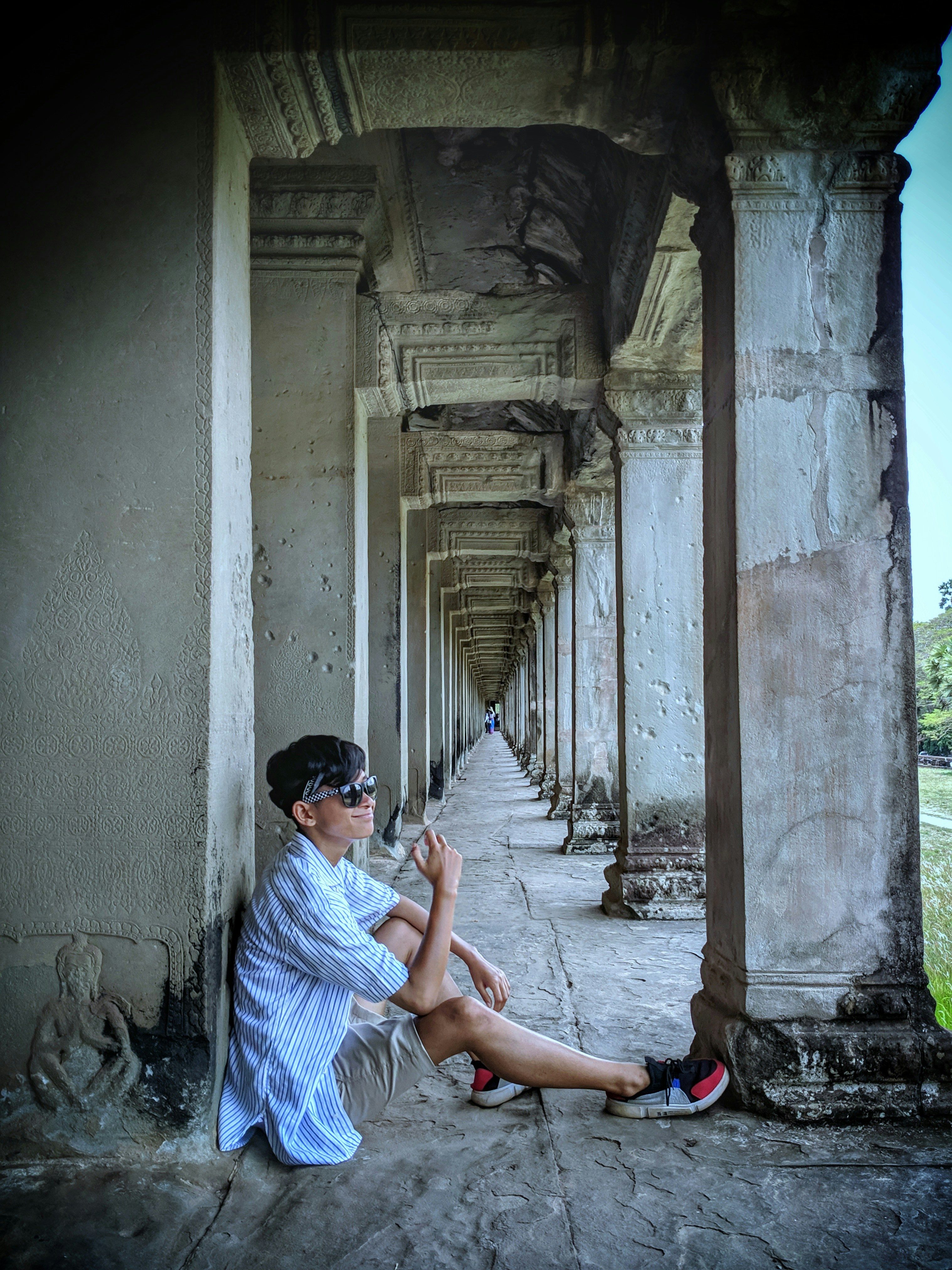 man sitting on floor at the temple