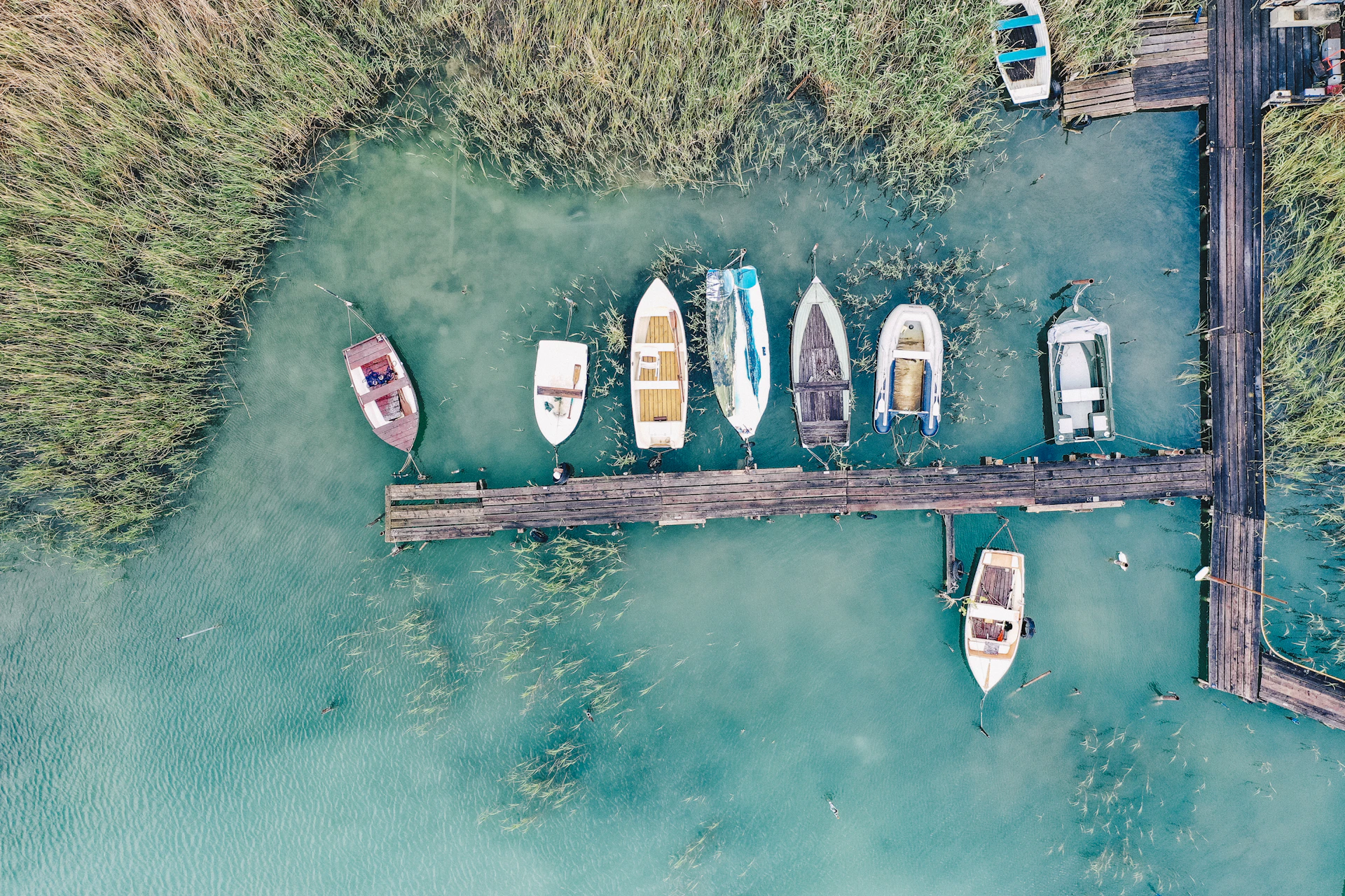 top view of a wooden dock with boats
