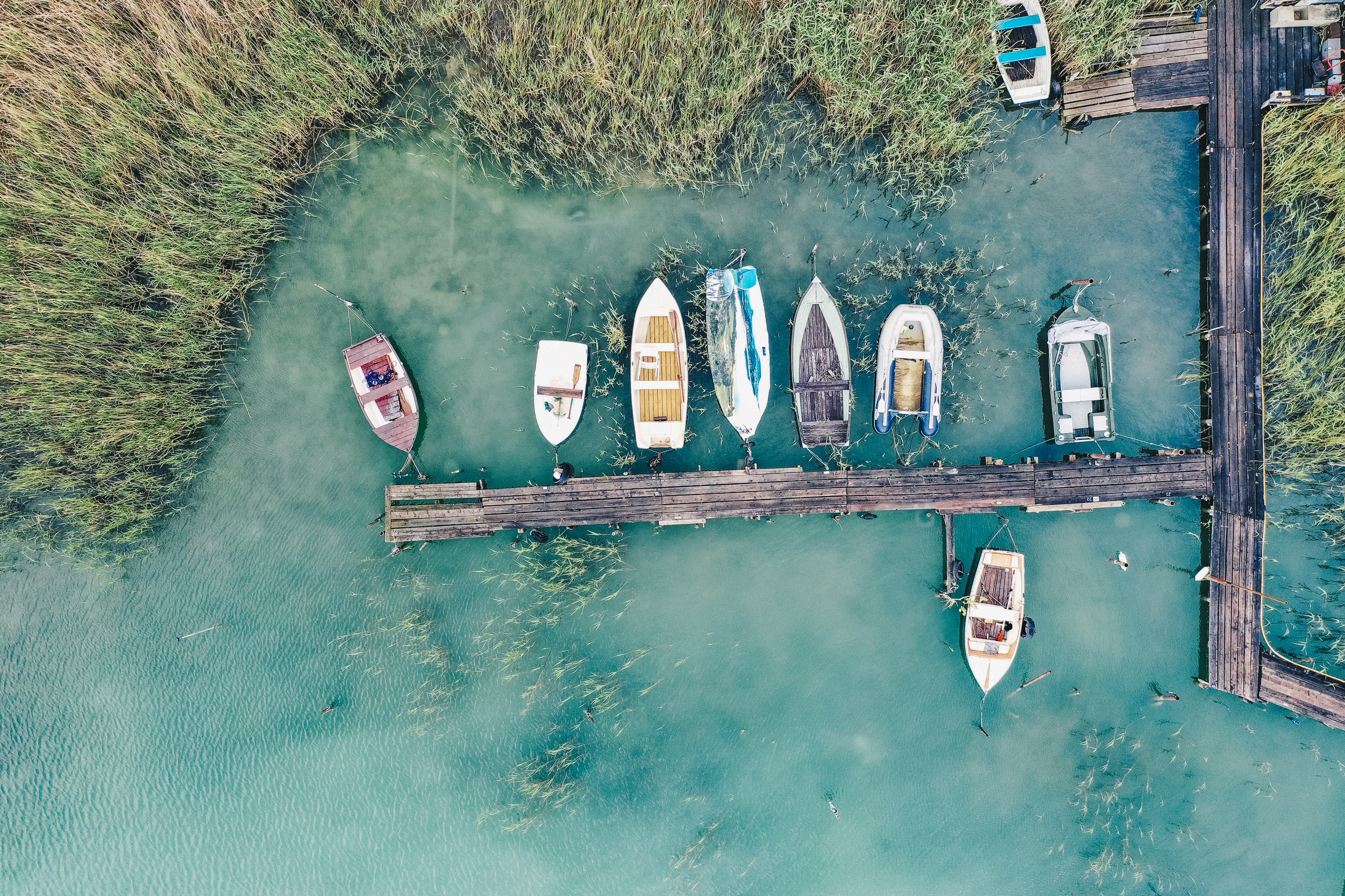 top view of a wooden dock with boats