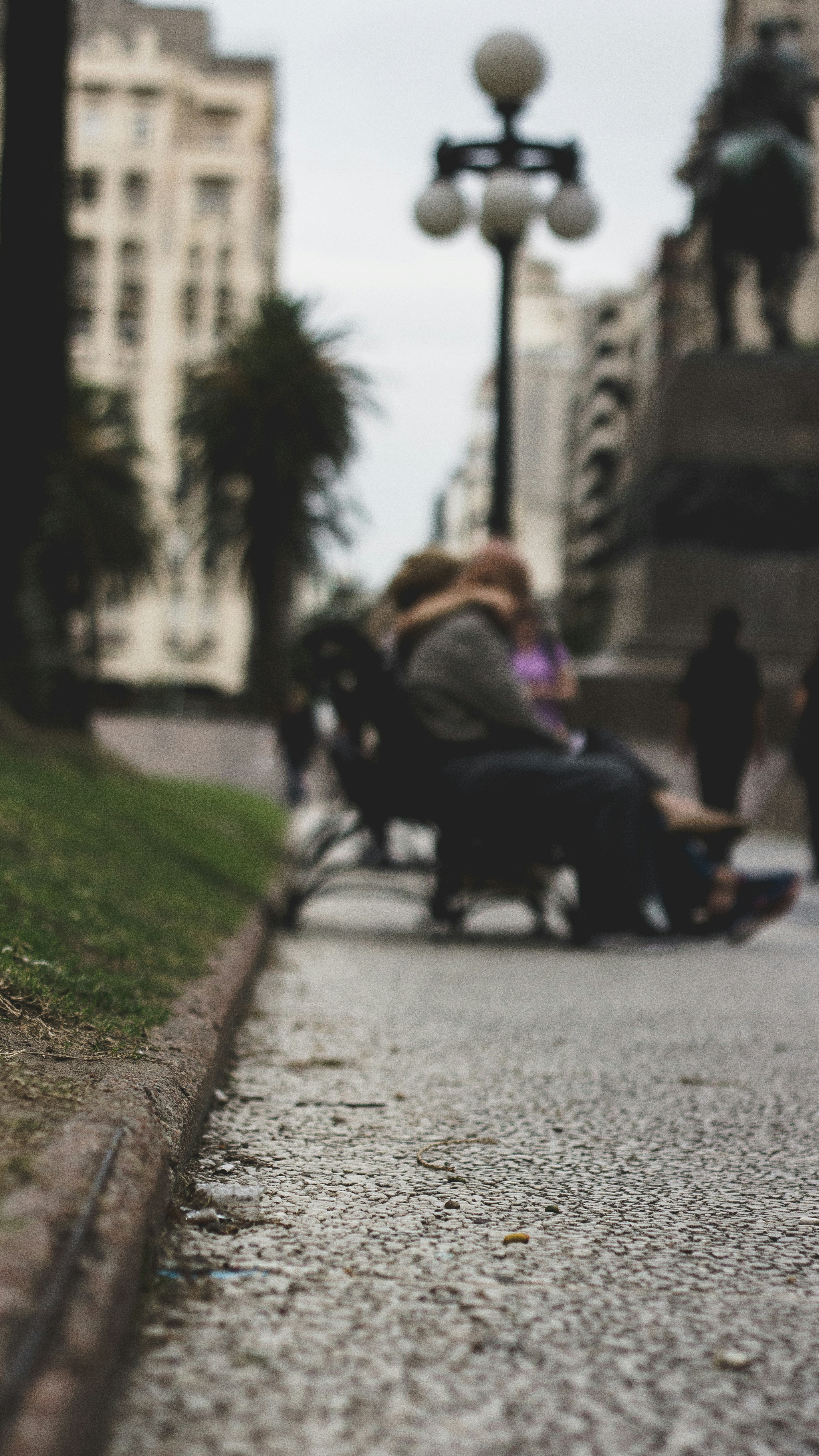 People Sitting On Benches Near Lamppost Photo Free Furniture