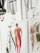 A set of fashion illustrations featuring stylish outfits and models. The drawings are done in watercolor, displaying a variety of clothing designs including dresses and coats, with attention to details such as patterns and accessories.