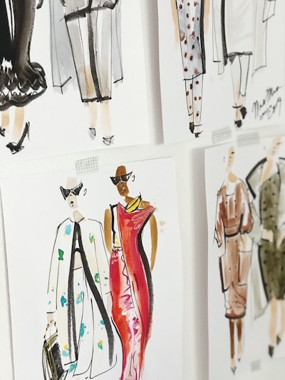 A set of fashion illustrations featuring stylish outfits and models. The drawings are done in watercolor, displaying a variety of clothing designs including dresses and coats, with attention to details such as patterns and accessories.