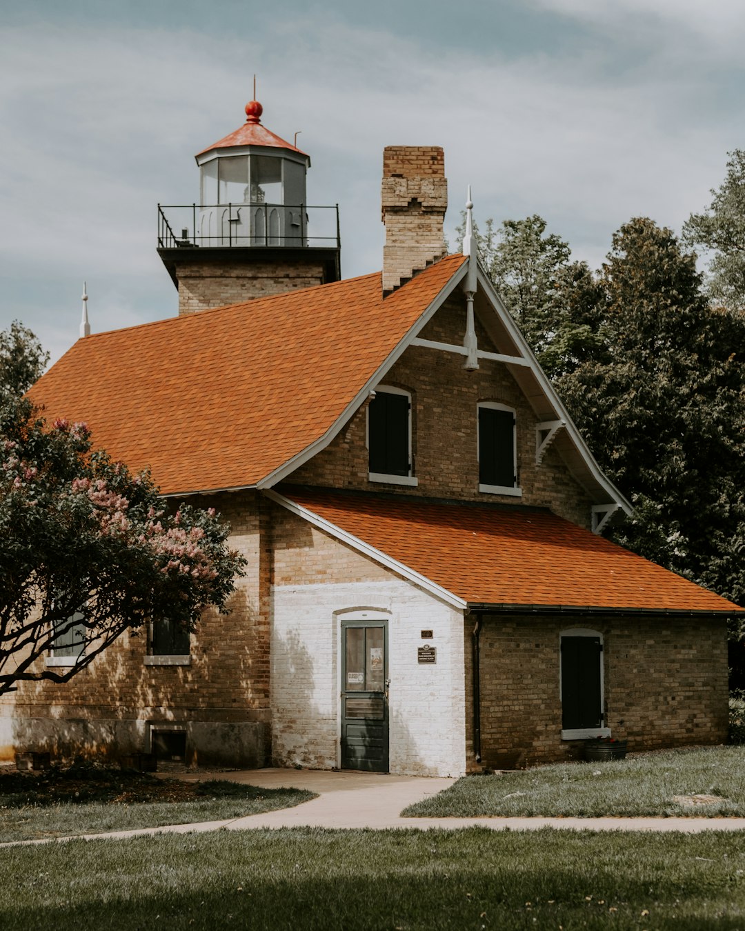 brown and white house near trees