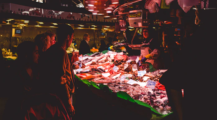 An Indian fisheries market bustling with activity under bright sunlight, reflecting vibrant livelihoods and economic pulse.