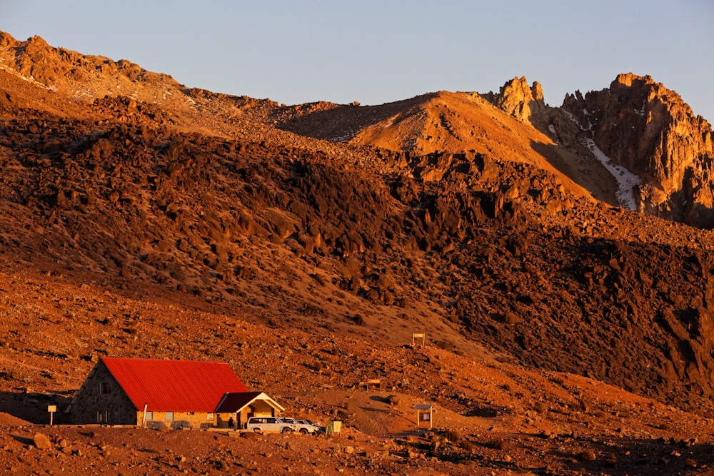 red and brown house on mountain