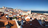 Beautiful panoramic view of Rio de Janeiro's coastline with clear blue skies and iconic Christ the Redeemer statue