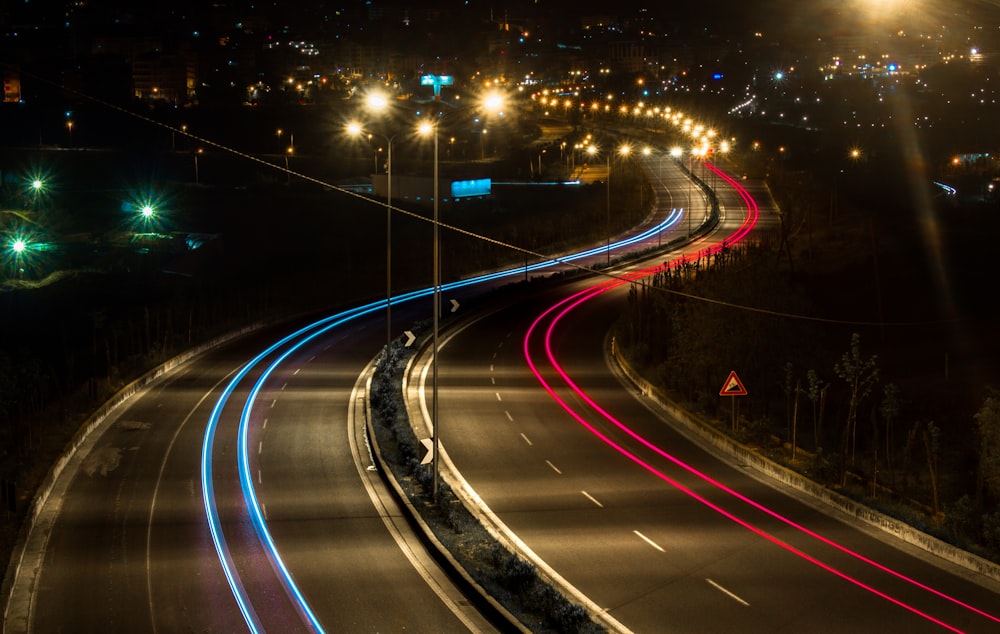 time lapse photography of road at night