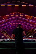 DJ facing DJ mixer
