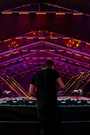 DJ facing DJ mixer