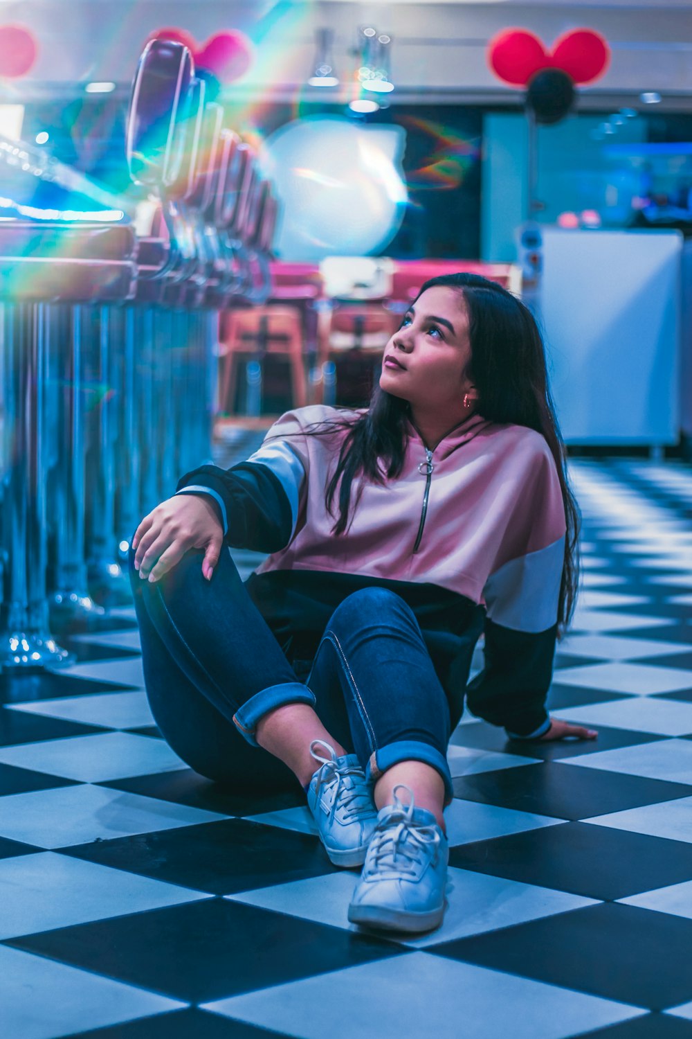 woman seated on floor in building