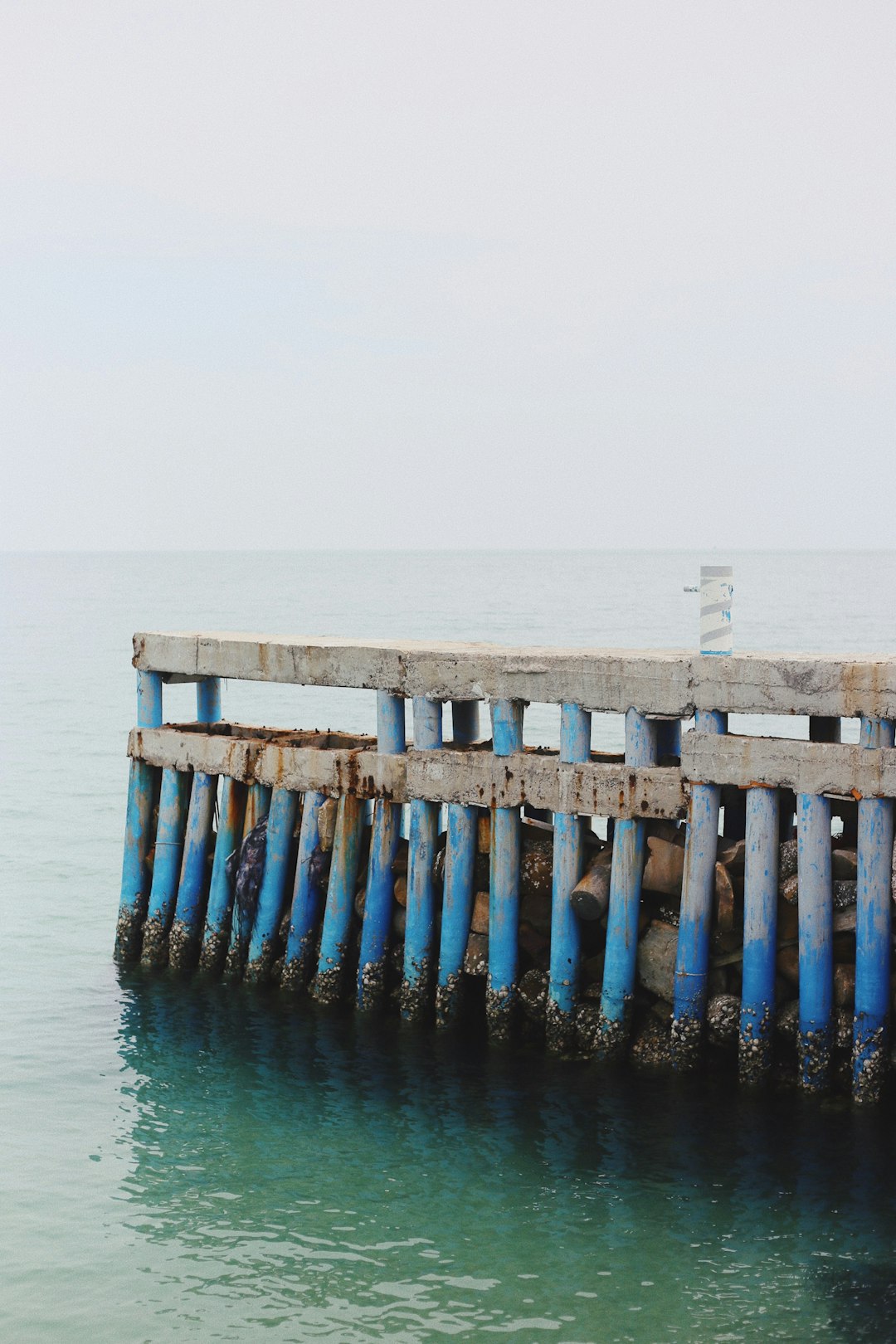 blue and gray concrete dock during day