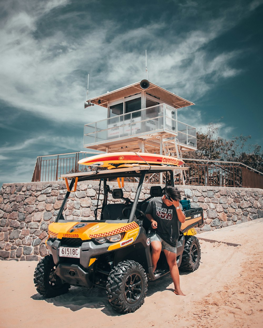 man on yellow and black UTV