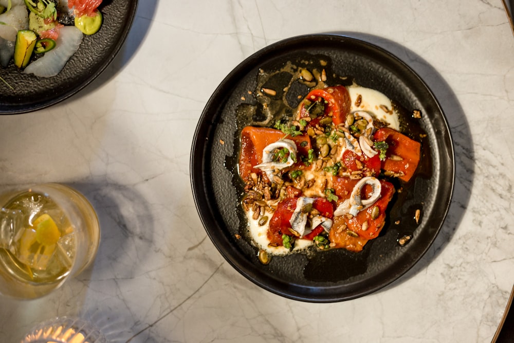 meat with red bell pepper and nuts on plate