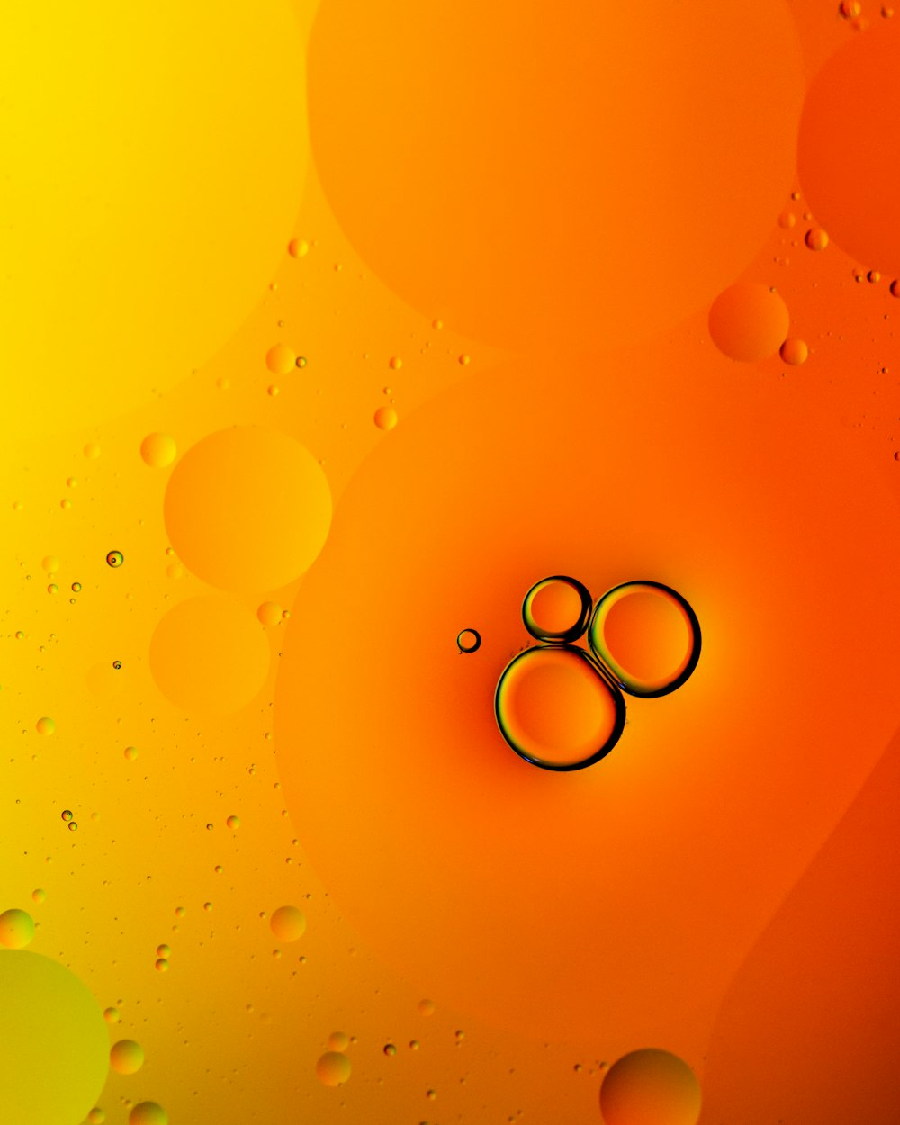 a pair of scissors sitting on top of a yellow and orange background