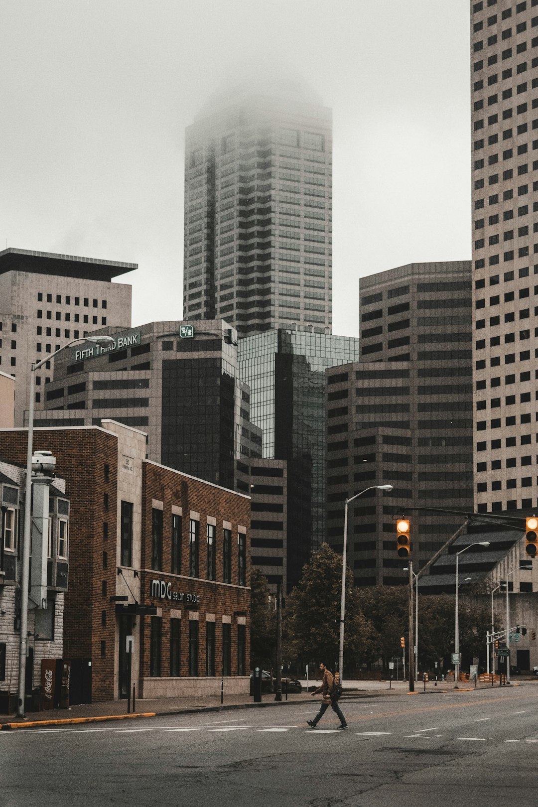 person walking on pedestrian lane during daytime