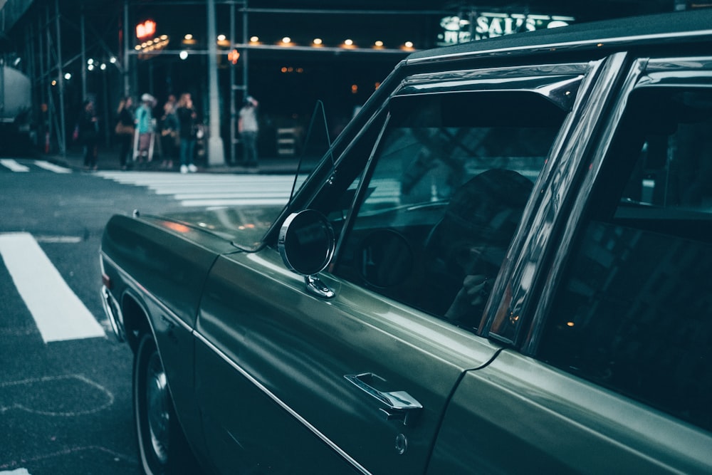 black car near pedestrian lane