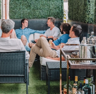 men sitting on chairs