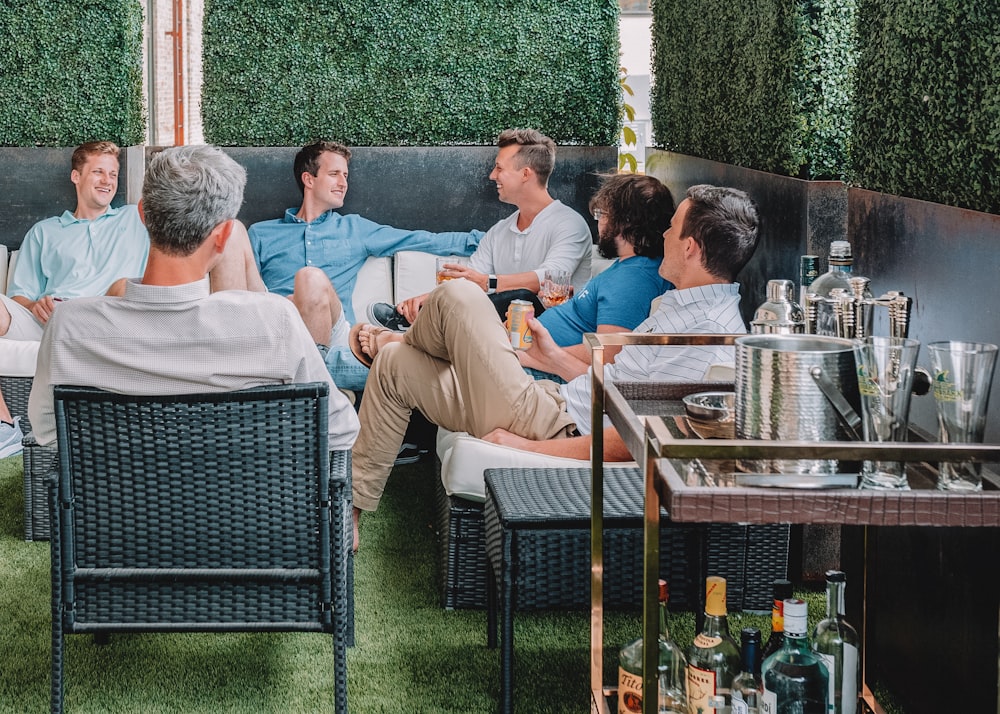 men sitting on chairs