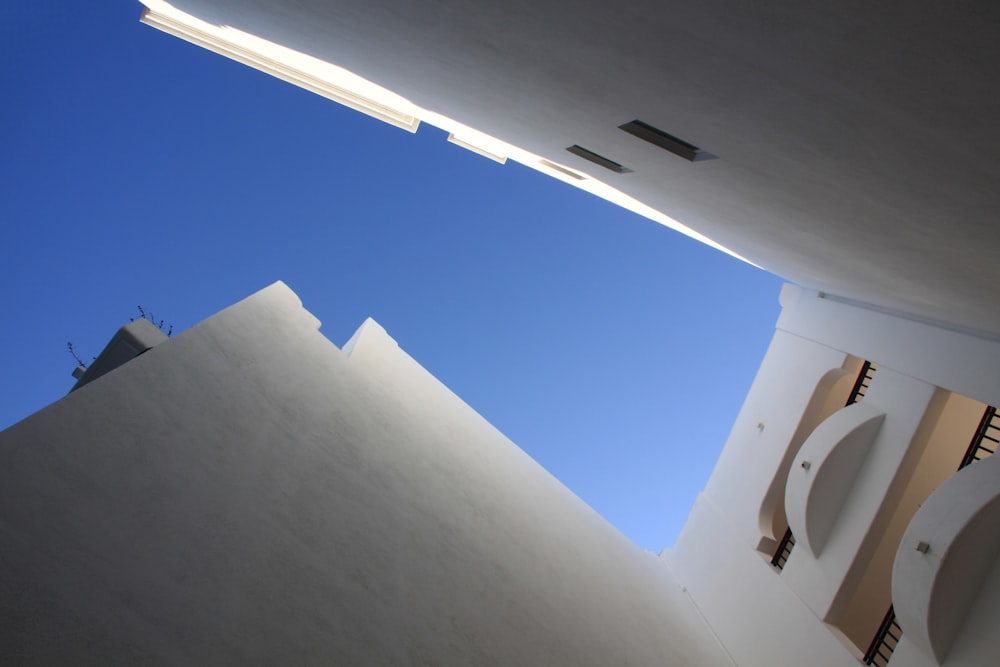 worm's eye view of a white cement building