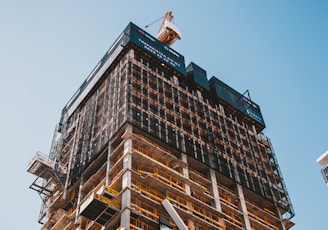 brown and gray building under construction