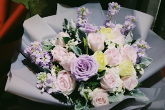 A stunning bridal bouquet with soft pastel colors.
