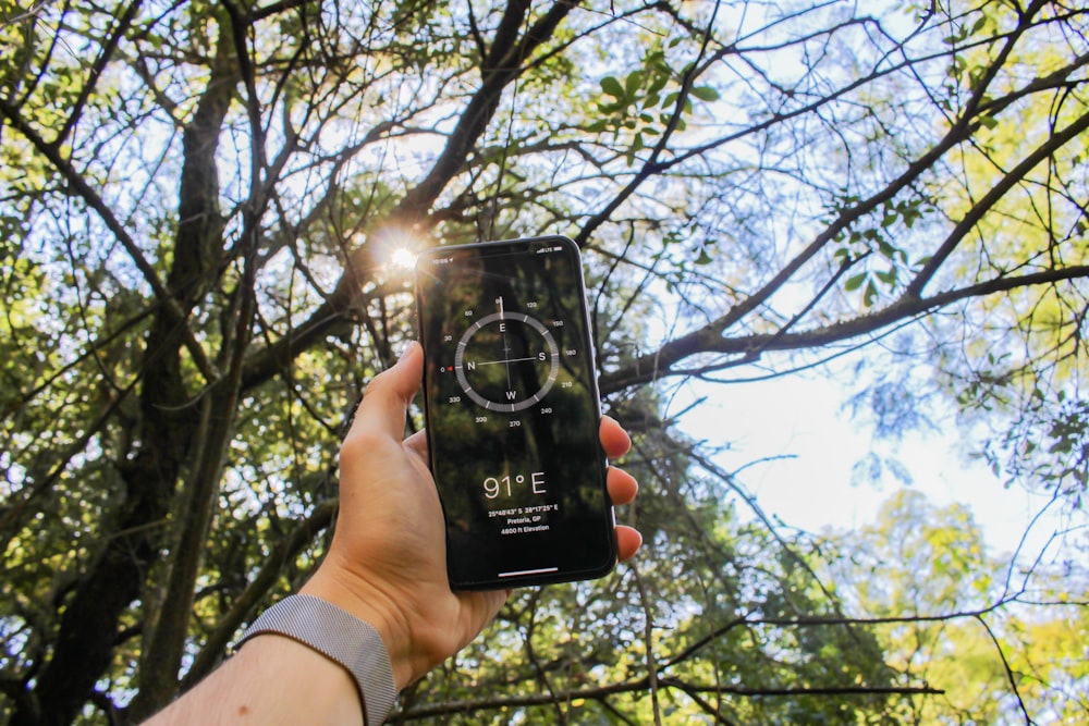 person holding black smartphone