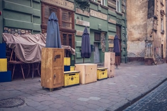 a row of boxes sitting on the side of a street