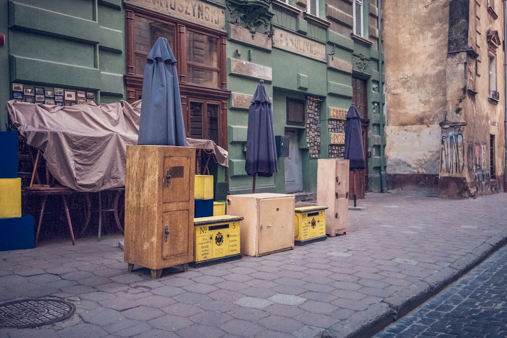 a row of boxes sitting on the side of a street