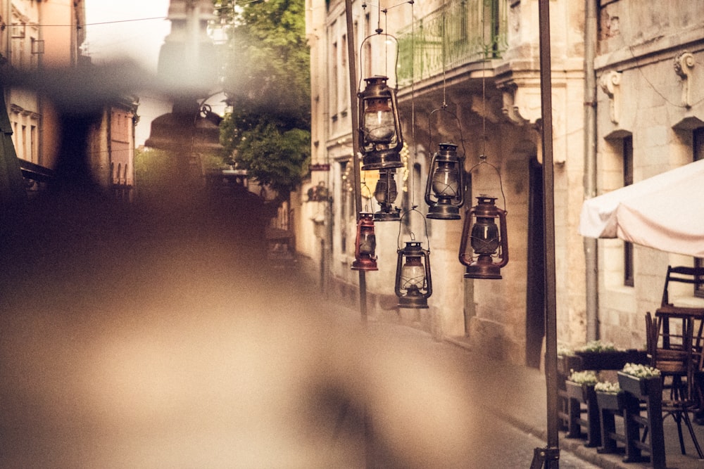 black and brown lantern lamps hanging near buildings