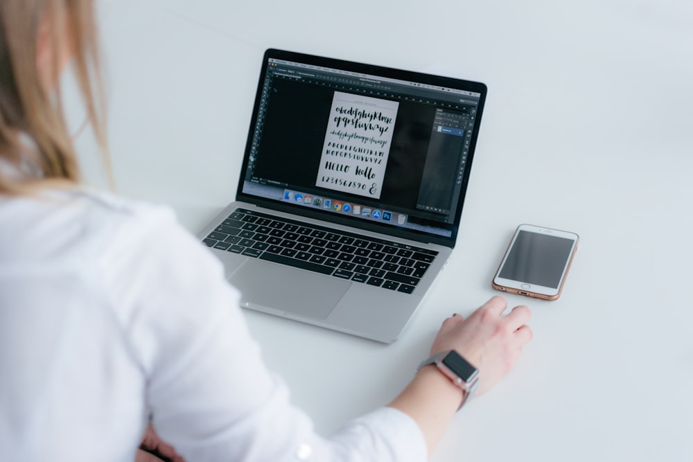 woman using MacBook