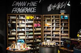 Perfume bottles and kitchenware neatly displayed on store shelves