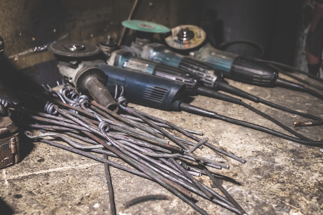 blue power tools and metal bars