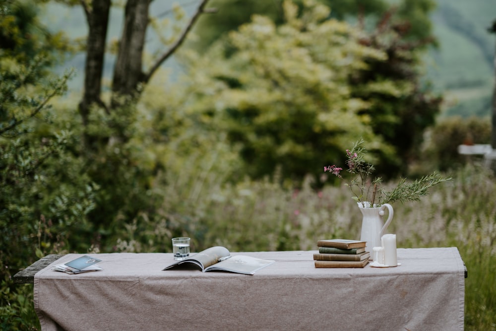 white book in a white table cloth during daytime