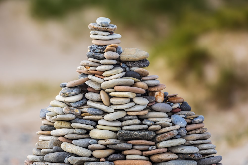 selective focus photography of stack of stones