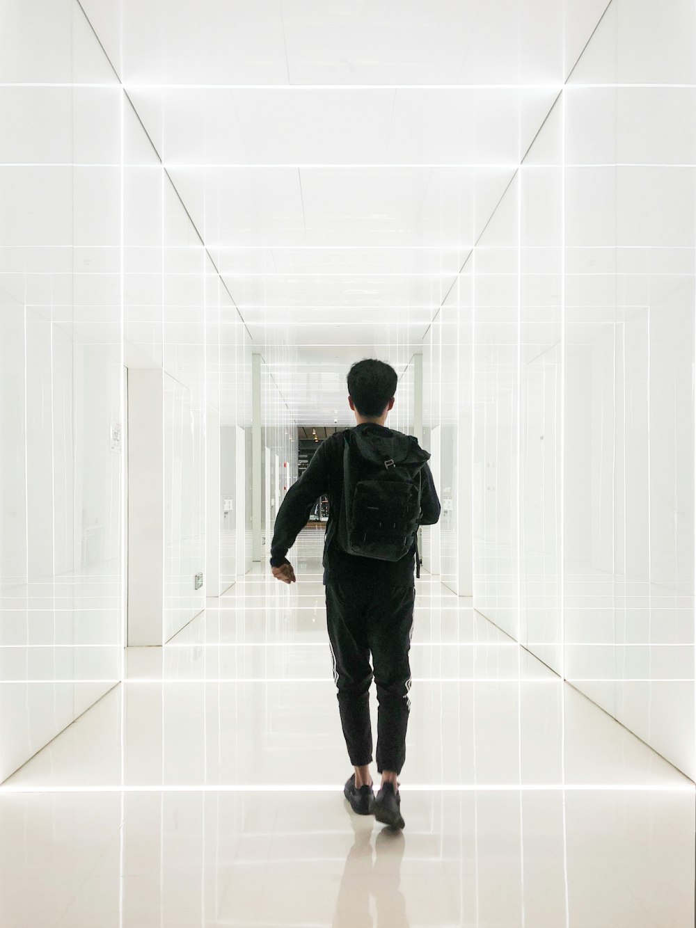 boy walking in hallway