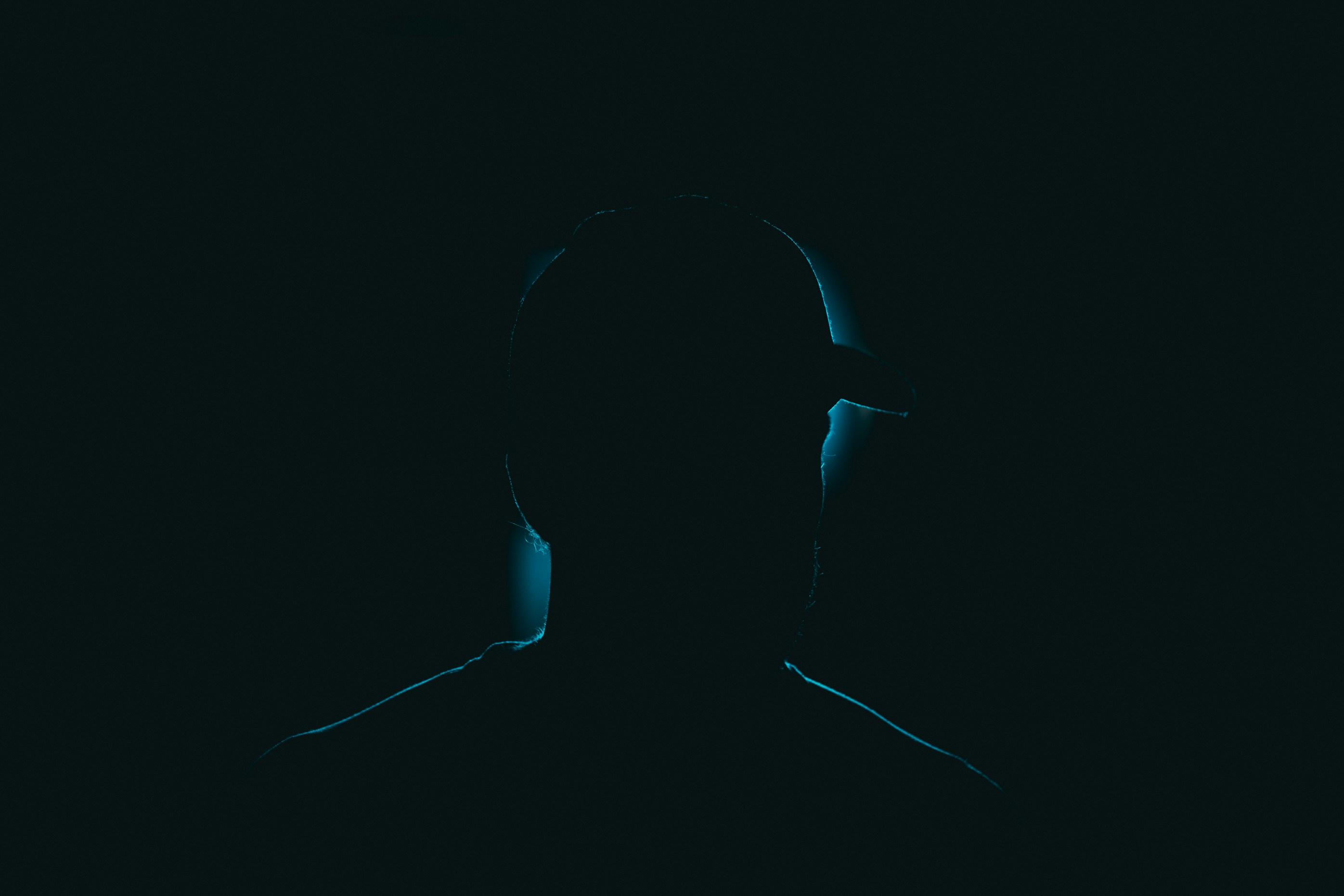 a silhouette of a person in the dark