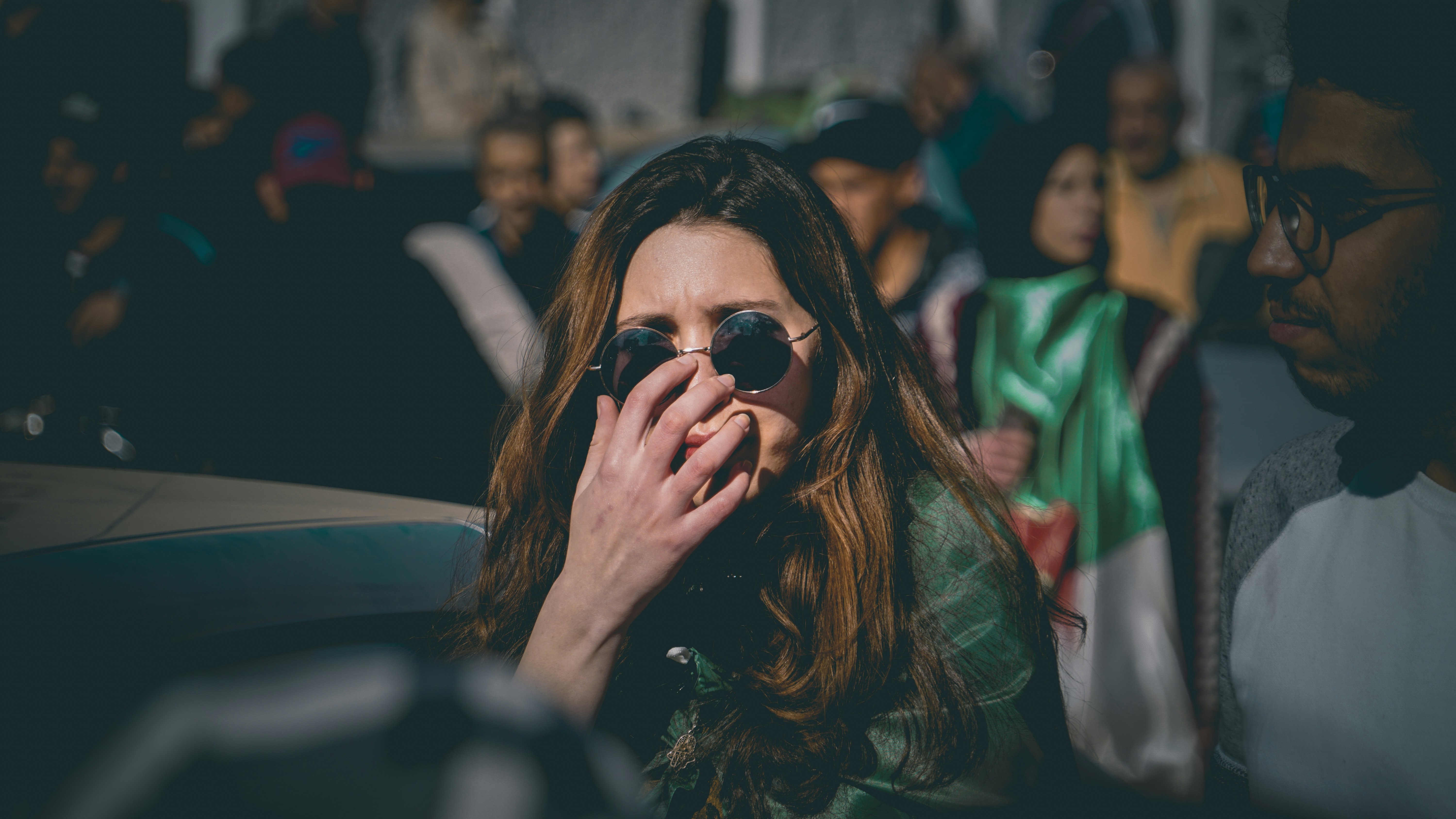 woman holding sunglasses