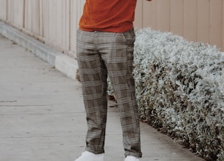 man standing near fence