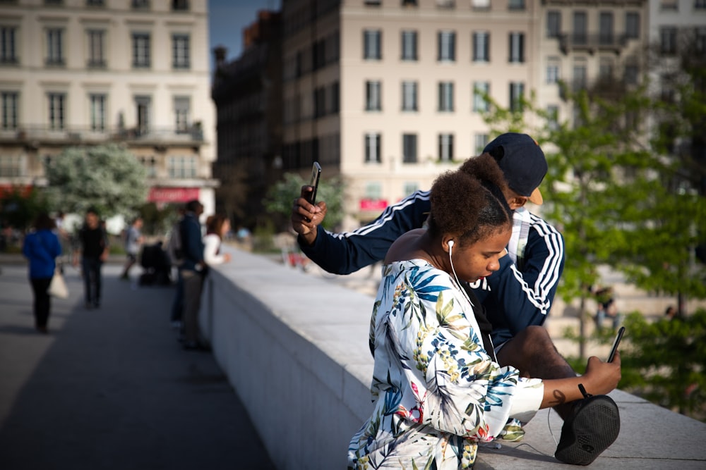 woman and man taking photos