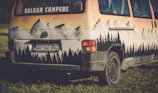 Close-up of a custom campervan awning fabric with a vibrant mountain design.